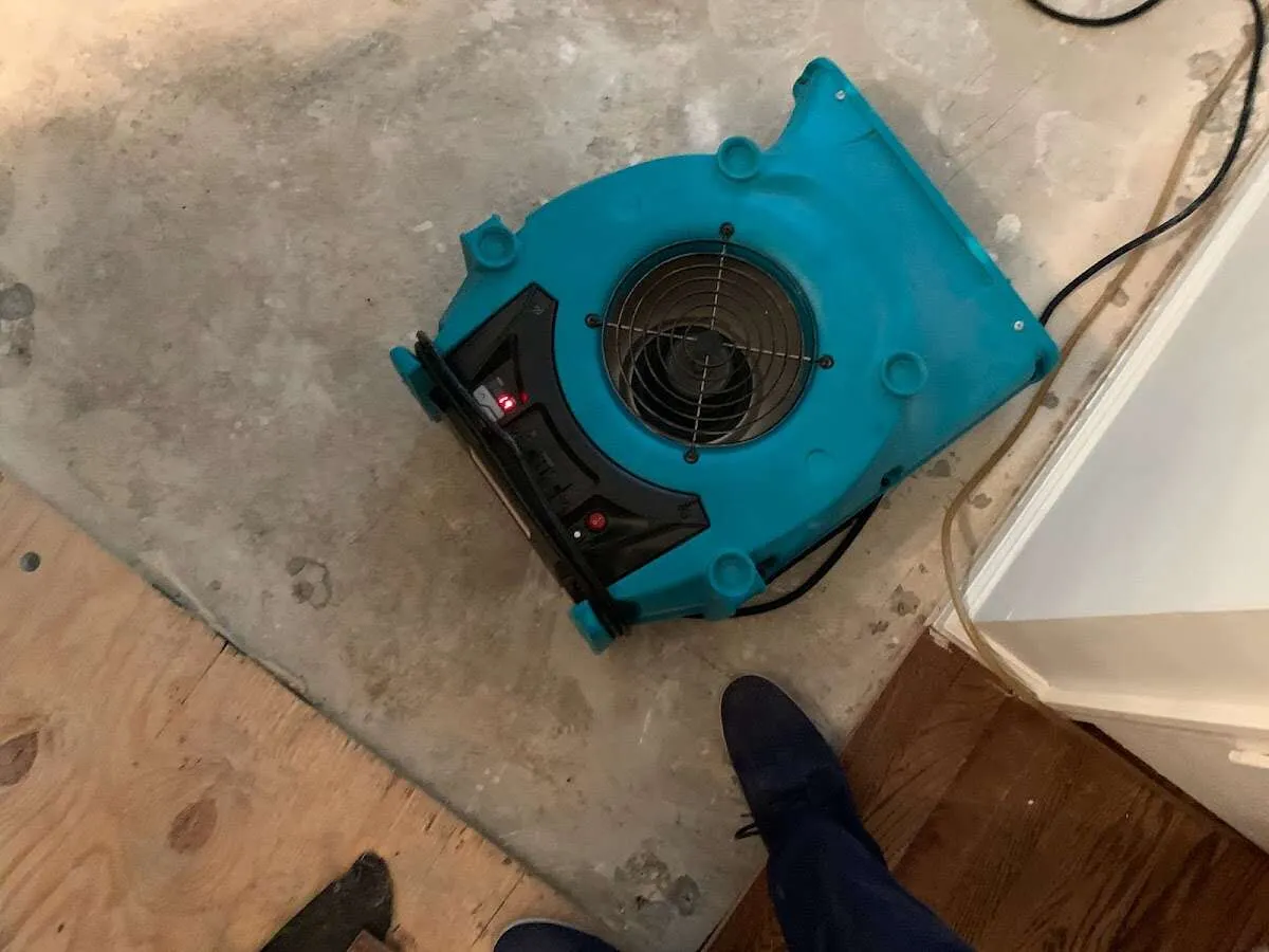 Air mover drying subfloor during Leak Detection & Repair in Osceola